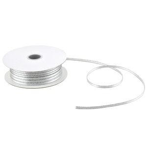 May include: A spool of silver ribbon with a white core. The ribbon is thin and has a subtle shimmer.