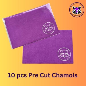 May include: Ten purple pre-cut chamois cloths with a white raccoon logo that says "Potteraccoon" and the text "All About The Clay".