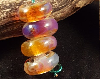 Amber purple boro glass design handmade lampwork beads.