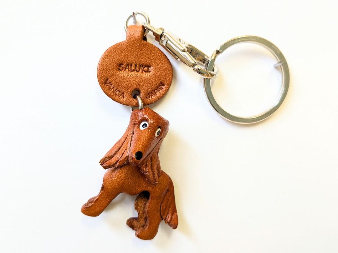 Portachiavi a forma di per peli di cane, in pelle ecologica in
