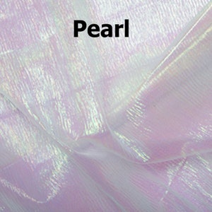 May include: A close-up of iridescent white fabric with a subtle pearlescent sheen. The fabric has a textured, woven appearance.