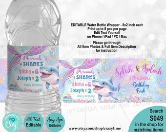 May include: A water bottle with a mermaid and shark-themed label. The label features the text "Mermaids & Sharks," names, ages, and "Happy Birthday!" The design includes a mermaid tail, a cartoon shark, and the text "Splish & Splash."