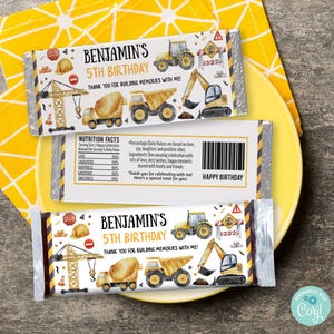 May include: A yellow and black construction themed chocolate bar wrapper with the text "Benjamin's 5th Birthday" and "Thank you for building memories with me!"