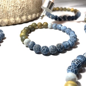 May include: Four beaded bracelets featuring a combination of blue, green and white beads. The bracelets are crafted from natural stone and have a distinctive, textured appearance.