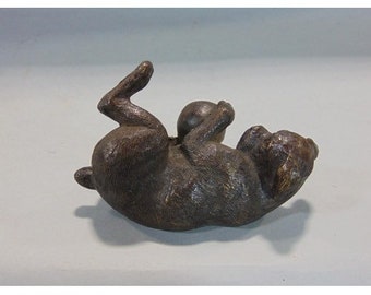 Vintage bronze dog  ,further hounds playing with a ball.