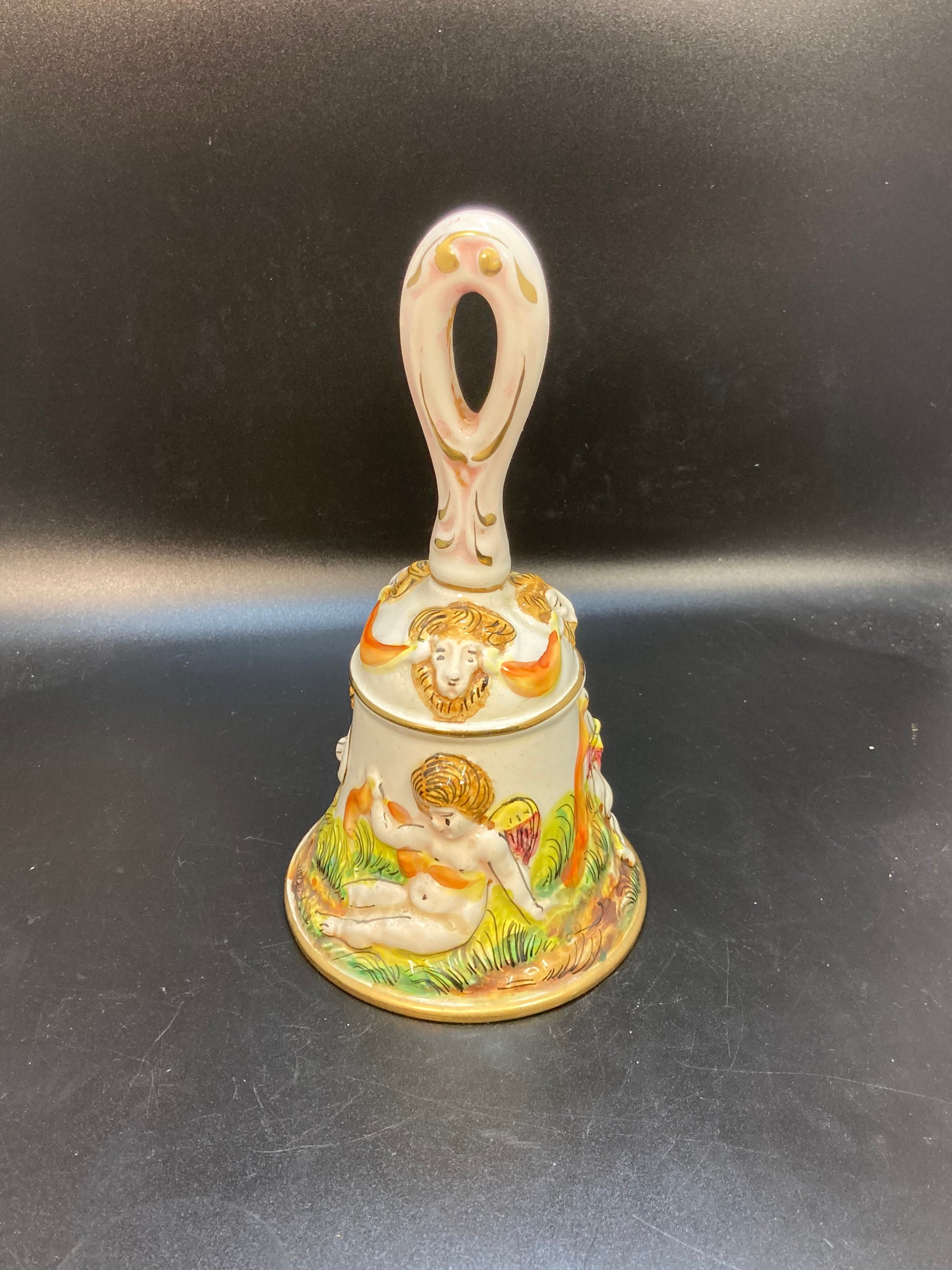 Antique, vintage Capodimonte italian  Porcelain a bell in relief with lovers and cherubs  in park, gilt  decoration, marked inside