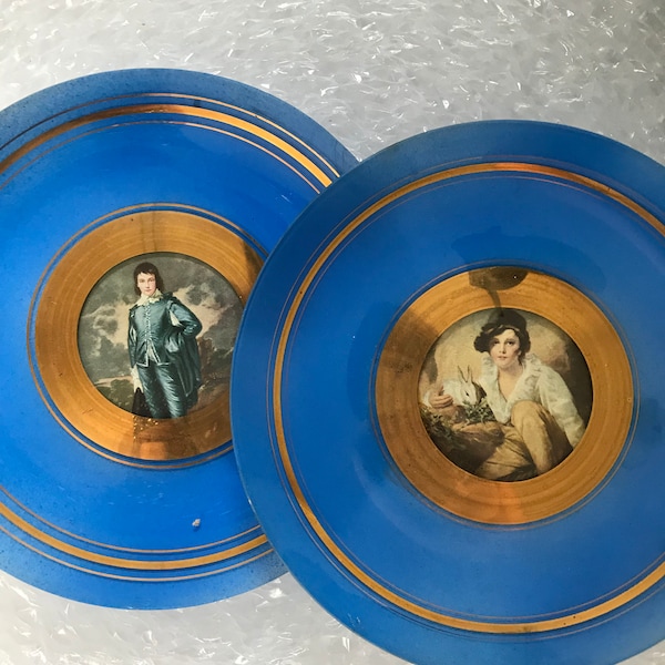 set of Pair early 20th century  decorative blue glass plates with potraits of boys and gilt decoration(2)