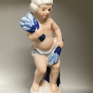 Vintage porcelain figurine of boy