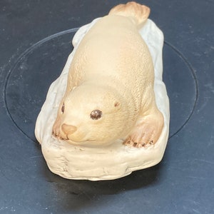 Vintage porcelain Aynsley figurine of baby seal , marked fine porcelain,made in England,signed by artist,dated 1975