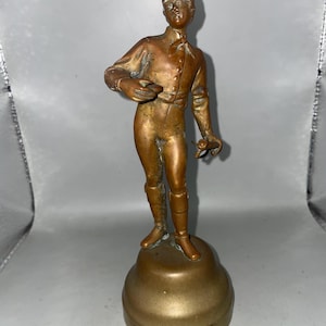Vintage,20th century bronze figure of man on brass stand