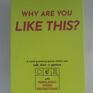 May include: A bright green box for the card game "Why Are You Like This?" with red text. The game is by Exploding Kittens and includes a card guessing game where you talk, draw, or gesture.