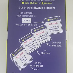 May include: A purple game box with yellow trim displays instructions for a word guessing game. The box shows example cards with phrases like "I can talk" and "I can draw." The game includes word cards, challenge cards, a notepad, and a pen.