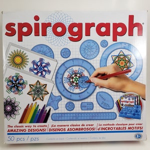 May include: Spirograph set with blue plastic gears and stencils, a red pen, and colourful markers. The box features the word "spirograph" in red, with examples of geometric designs. The set includes 50 pieces and is for ages 8+.
