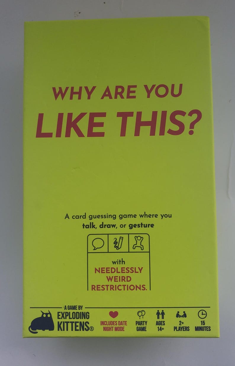 May include: A card game box with a bright yellow background and red text that reads "WHY ARE YOU LIKE THIS?". The box also includes the text "A card guessing game where you talk, draw, or gesture". The game is by Exploding Kittens.