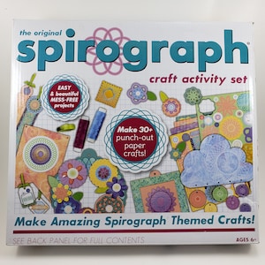 May include: The original Spirograph craft activity set box features a colourful design with a variety of punch-out paper crafts. The box includes the text "Make 30+ punch-out paper crafts!" and "Make Amazing Spirograph Themed Crafts!" The box is for ages 6 and up.