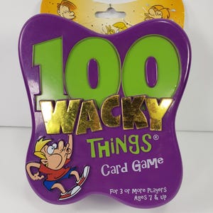 May include: A purple card game package with the words "100 WACKY THINGS" in gold and green. The package features a cartoon character and the text "Card Game" and "For 3 or More Players Ages 7 & Up".