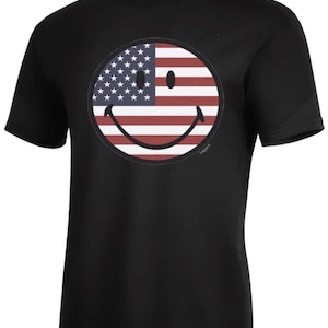 May include: Black t-shirt with a smiley face design featuring the American flag.