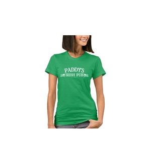 May include: A green t-shirt with white text that reads "Paddy's Irish Pub".