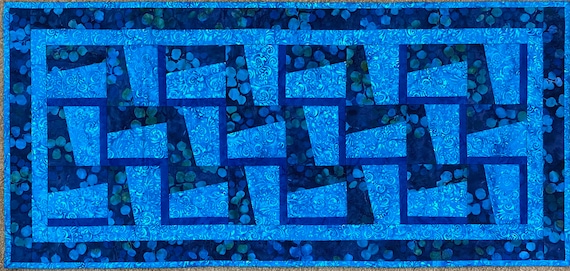 38 by 18 inches. Reversible table runner