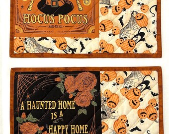 Grote placemats voor Halloween, met geborduurde details.