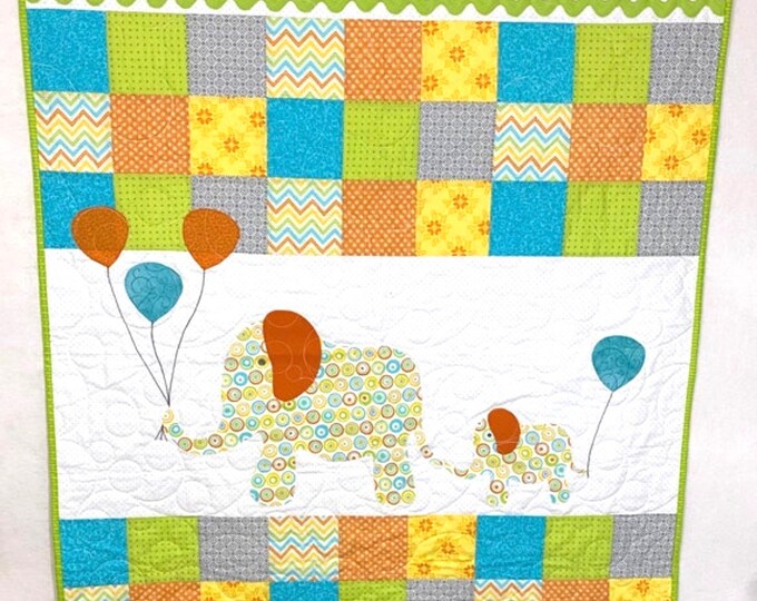 Baby quilt, wall hanging, or play blanket. Mama and baby design measures 42” by 54”. Machine appliqué and quilted, hand stitched binding