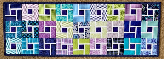 32 by 11 inches. Reversible table runner