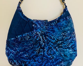 Purse. Hobo style shoulder bag made with a combination of cotton batik and denim