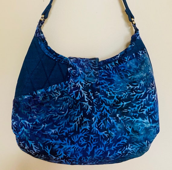 Hobo style shoulder bag made with a combination of cotton batik and denim