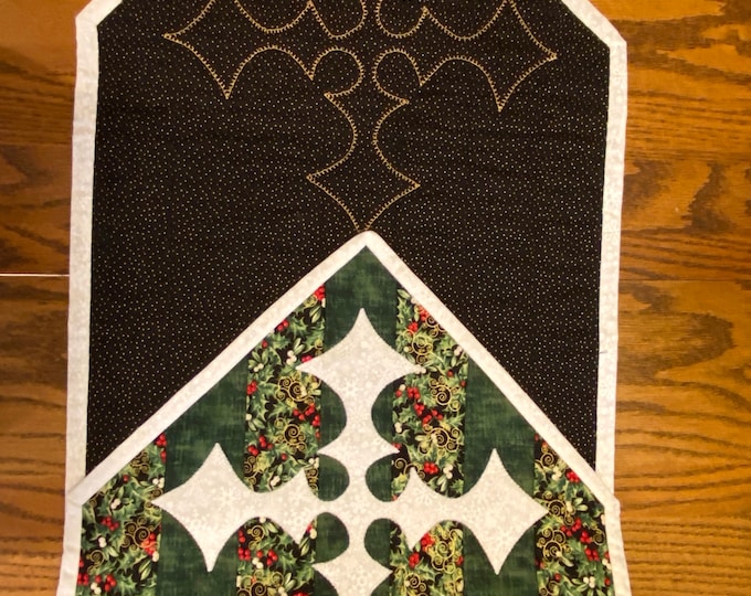 Christmas runner/table scarf. Green stripe with appliqué star at each end. Backing is black with gold shape for star