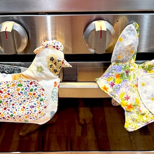 Luvas de forno para galinhas, coelhos e gatos.