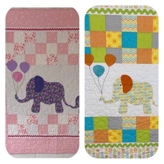 Baby quilt, wall hanging, or play blanket. Mama and baby design measures 42” by 54”. Machine appliqué and quilted, hand stitched binding