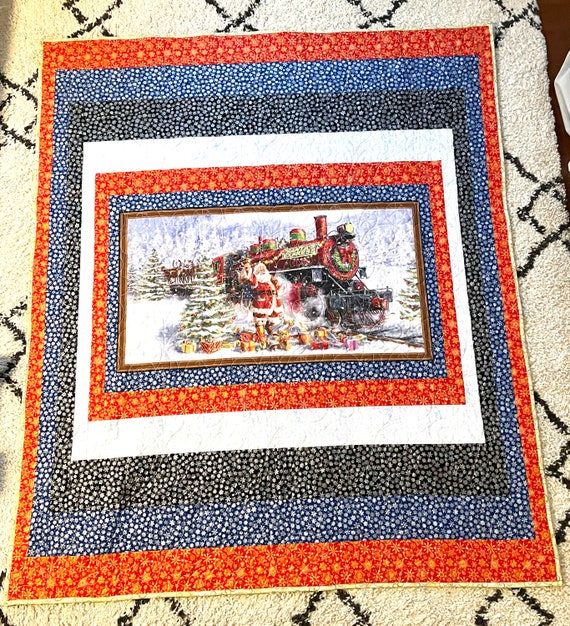 Santa’s Christmas train 66” x 78”machine quilted swirling lightweight blanket, machine sewn border