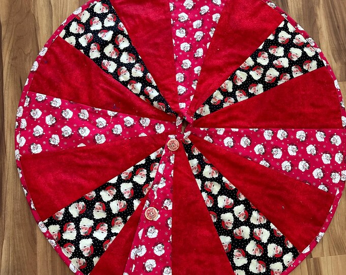 It’s all Santa tree skirt 32” across  reversible