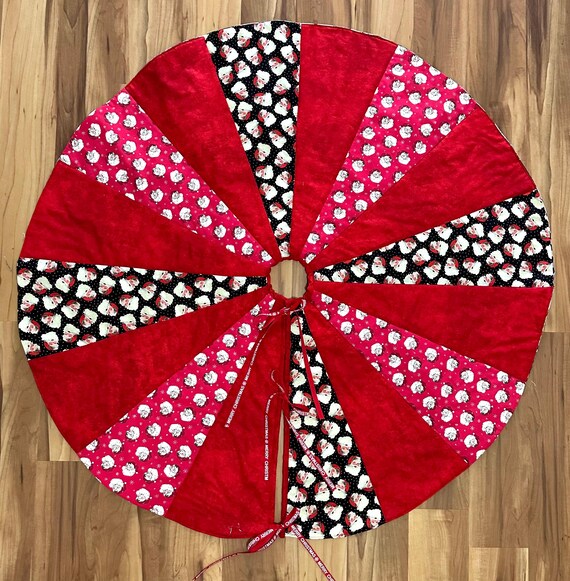 It’s all Santa tree skirt 42” across reversible