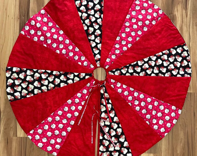 It’s all Santa tree skirt 42” across reversible