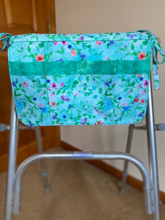 walkers or wheelchair carryall bag/flowers on blue green background. Last one in this fabric