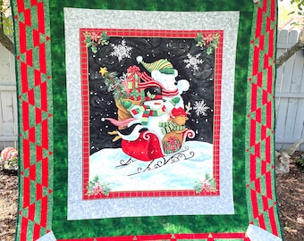 Reduced snowman 64” x 74” machine quilted snowman theme, lightweight blanket dark green back swirling embroidered