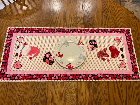 Gnome table runner for your Valentine decor, approx 41” by 17”. Plate not included.