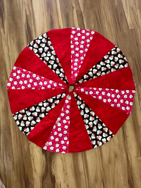 It’s all Santa tree skirt 40” across  reversible