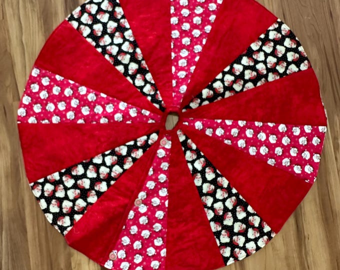 It’s all Santa tree skirt 40” across  reversible