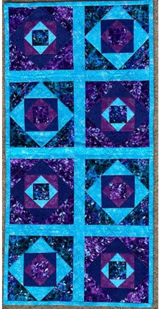 Reversible table runner. 27” by 13”.