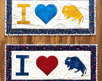 Buffalo themed table runners. 16” x 35” blue heart 16” x 36” red heart Reversible