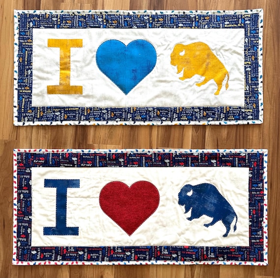 Buffalo themed table runners. 16” x 35” blue heart 16” x 36” red heart Reversible
