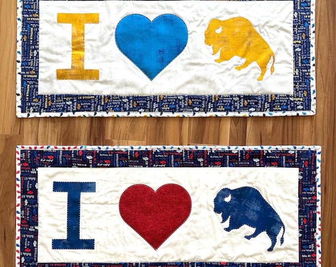 Buffalo themed table runners. 16” x 35” blue heart 16” x 36” red heart Reversible