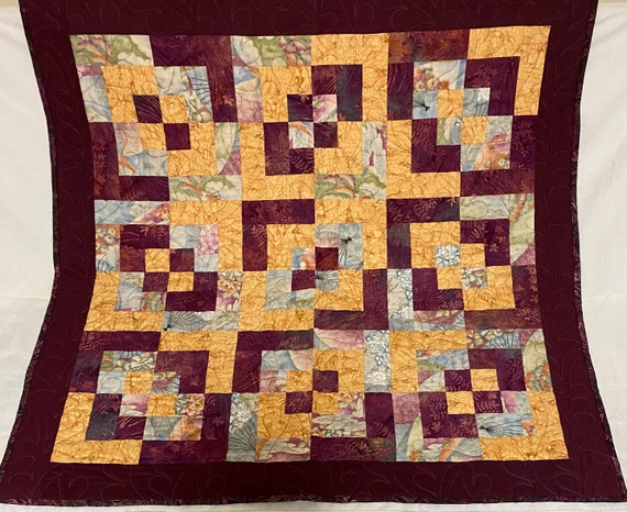 Quilted batik 41” square table topper or card table cover. Can also be used as a lap robe for warmth while sitting in a chair.