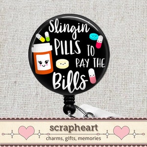 May include: Black and white badge reel with a black and white cartoon pill bottle with the text "Slingin' Pills to Pay the Bills".