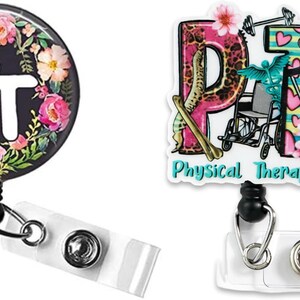 May include: Two badge reels with white plastic straps and metal snaps. The left reel is circular with a black background, pink and orange flowers, and white letters PT. The right reel is shaped like the letters PT with medical icons and text.