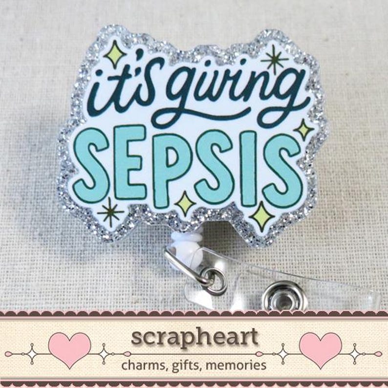 May include: A badge reel with the phrase "it's giving SEPSIS" in teal and black lettering, outlined in white. The badge has a silver glitter border and star accents. The reel has a clear plastic clip and a white retractable cord.