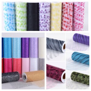 May include: Assortment of tulle rolls in various colors and patterns, including solid colors, glitter, polka dots, and animal prints. The rolls are approximately 6 inches in diameter and 10 yards long.