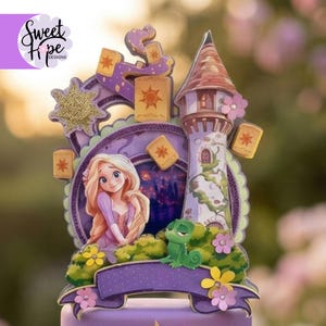May include: A purple and gold cake topper featuring a cartoon princess, a tower, and floating lanterns. The topper has a banner at the bottom and the text "Sweet Hope Designs" in the upper left corner. The princess has long blonde hair and is wearing a purple dress.